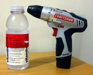 The 20oz bottle-sized drill can stand upright on a flat surface.