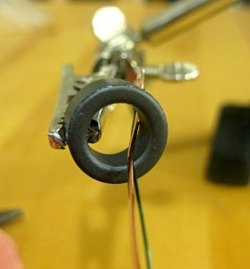 Insert 2 wires into a ferrite ring.